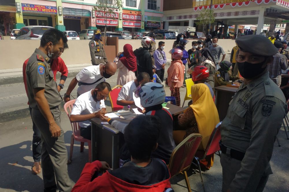 Tidak Pakai Masker, 9 Warga Tampan Diberi Sanksi