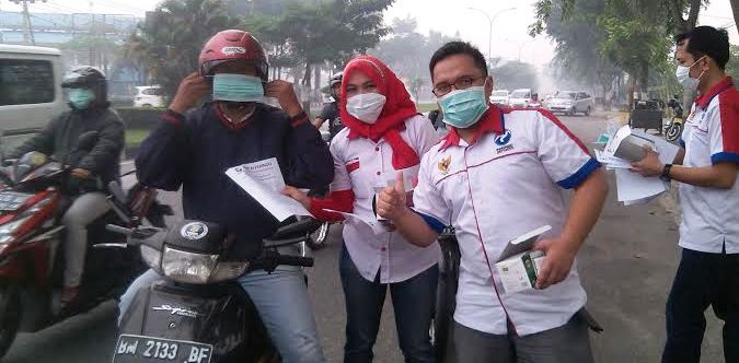 Peduli Bahaya Asap, Perindo Riau Bagi-bagi Masker