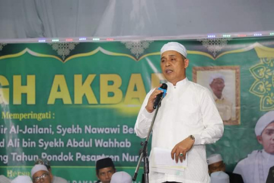 Ditengah Guyuran Hujan, Pj Bupati Inhil H. Herman Hadiri Haul Jama' Di Ponpes Nur Darissalam Harapan Tani Kempas
