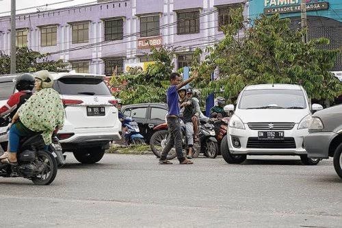 Pak Ogah Marak Dimana-mana, Dishub Pekanbaru Sebut Mereka Kucing-kucingan...